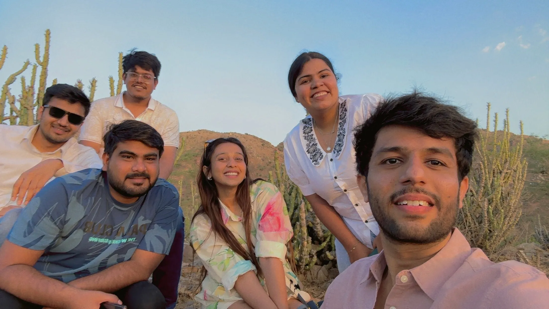 Teammates on a hillside at dusk