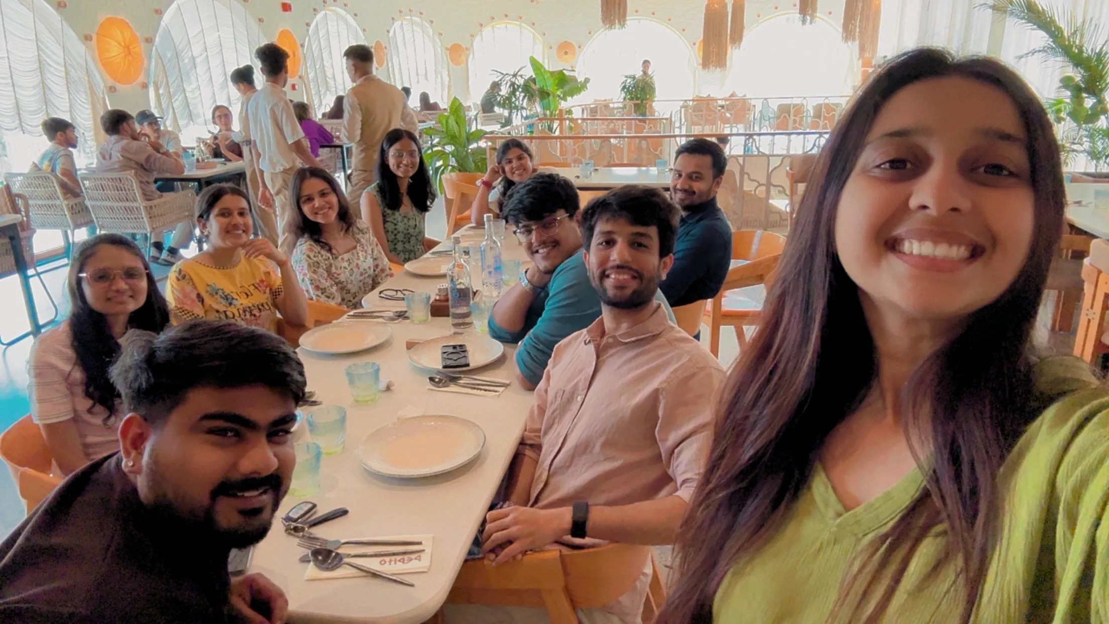 The team sharing a long lunch table
